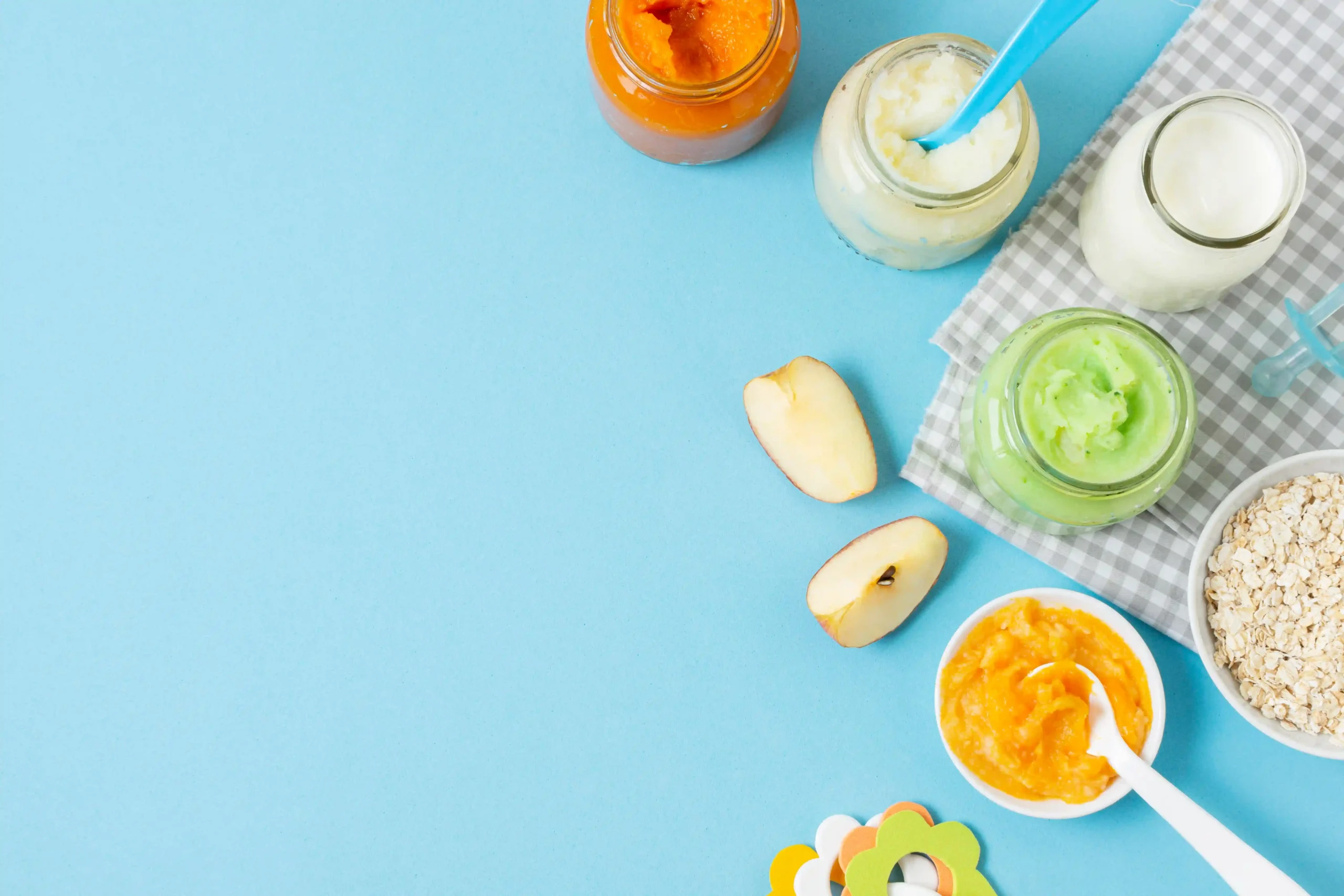 baby-food-blue-background-top-view